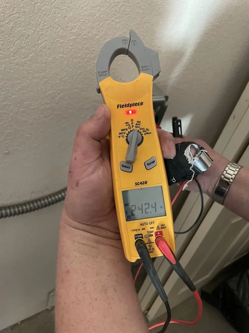 Voltage testing with clamp meter during Outlet Installation in Edinboro